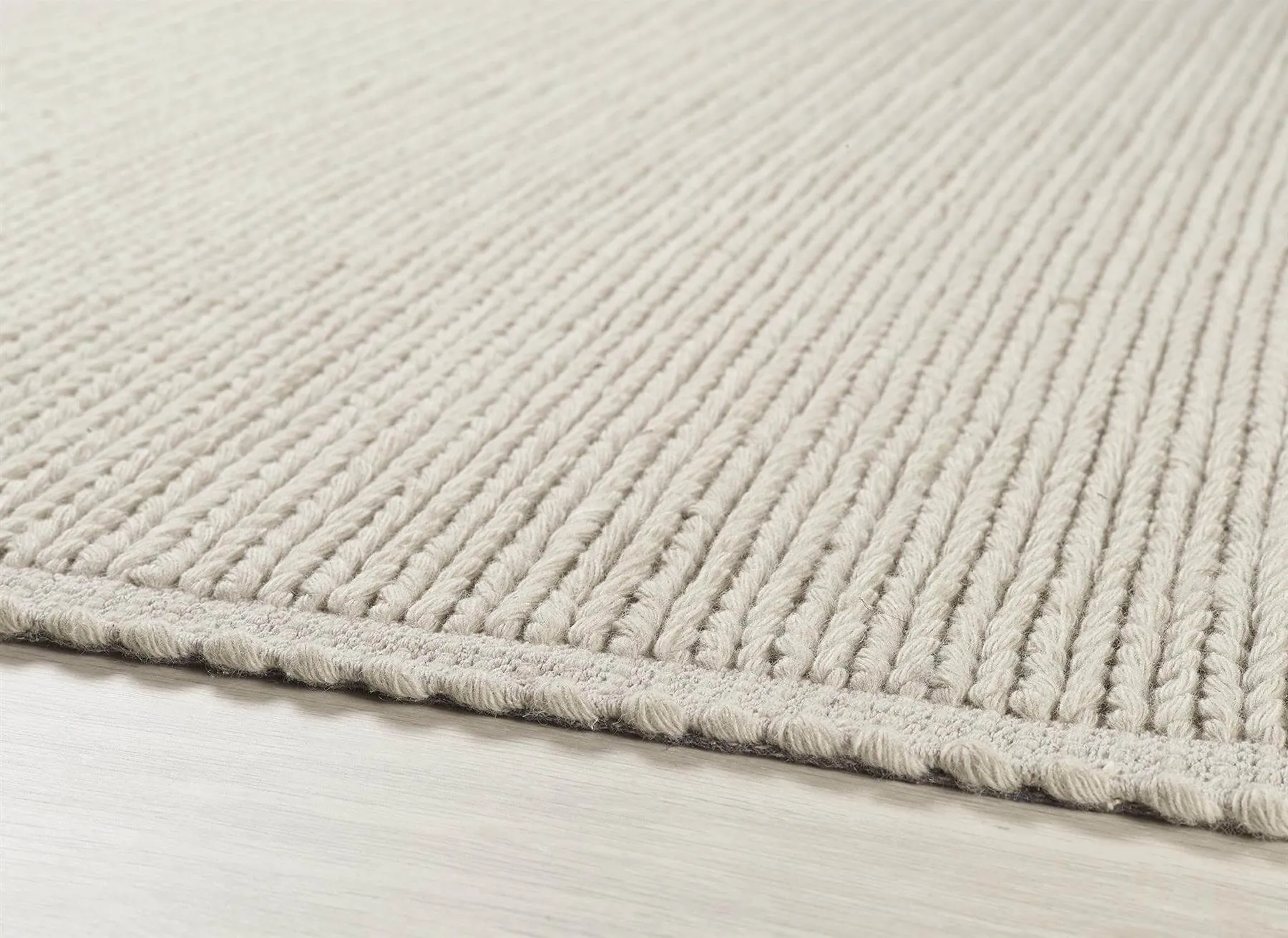 Solid Natural Knitted Wool Rug